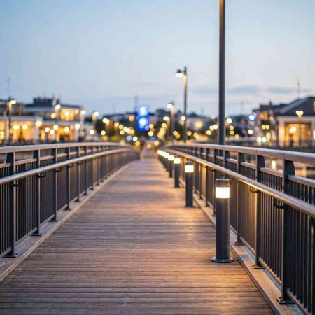 Pedestrian bridge over the river in the city at night.