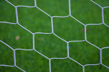 Football net on green grassの写真素材