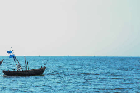 Bird Fishing boats on the beach bangsaen Thailandの写真素材