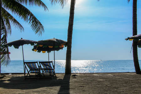 Beach beds and umbrellas on  the beach bangsaen Thailandの写真素材