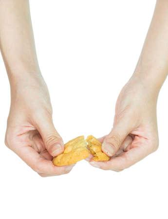 Isolation Hand holding cookie on white studio background の写真素材