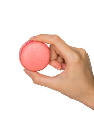 Isolated Hand holding Colorful macaronsの写真素材