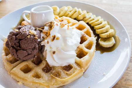 ice cream on honey waffle with banana の写真素材