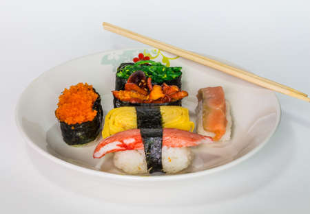 Sushi on a white dish done の写真素材