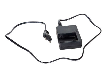 Battery charger charging a camera battery の写真素材
