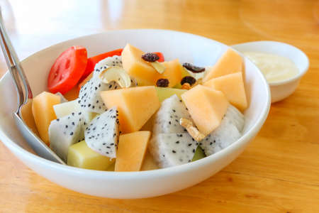 Fresh fruit salad in a glass cup の写真素材