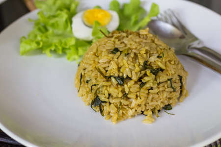 fried rice with green curry chicken serve with vegetables.の写真素材