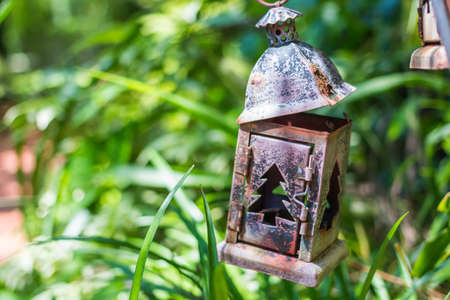 Old garden lamp on sidewalk.の写真素材