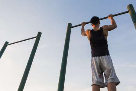 Pull-up strength training exercise  doing chin-ups / pull-ups as part of a crossfit workout routine.