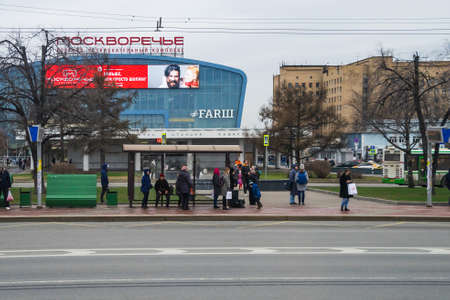 Moscow, Russia - April 13 2019 : People wait for a bus at a bus stop.のeditorial素材