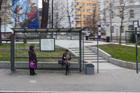 Moscow, Russia - April 13 2019:People wait for a bus at a bus stop.のeditorial素材