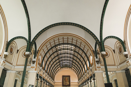 Inside Saigon Central Post Office with photo of Ho Chi Minh on the wall. Vietnamのeditorial素材