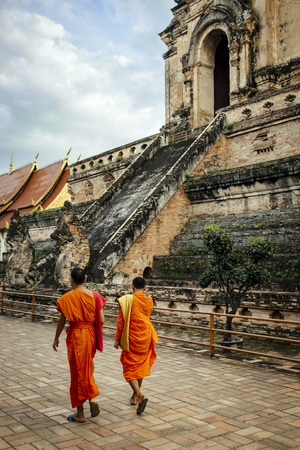 Monks walking by Wat Chedi Luang Temple in Chiang Mai, Thailandのeditorial素材