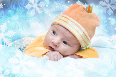 Photo of the little girl in winter snowflakesの写真素材