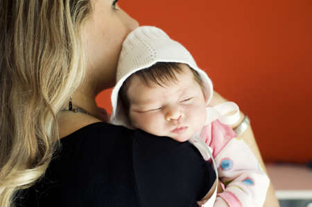 The newborn girl on hands at the mumの写真素材