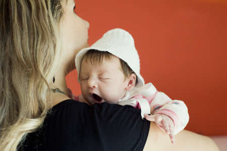 The newborn girl on hands at the mumの写真素材