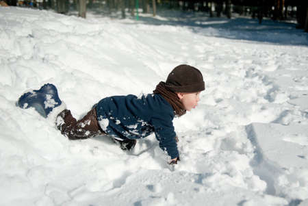 Boy Playing with snowの写真素材