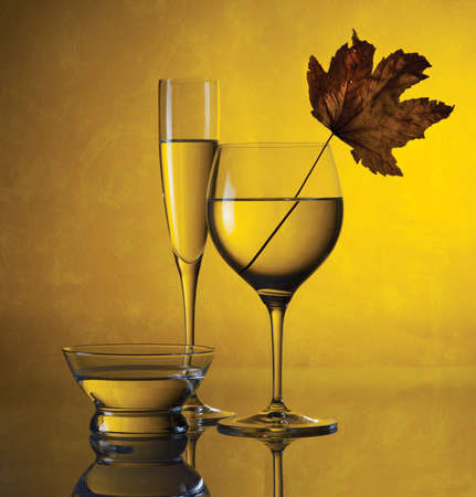 A beautiful still life of glass jars on a yellow backgroundの写真素材