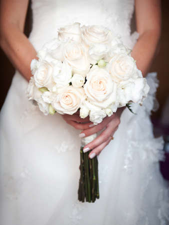 Beautiful wedding bouquet in hands of the brideの写真素材