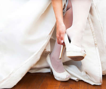 woman wears a wedding shoes with heelsの写真素材