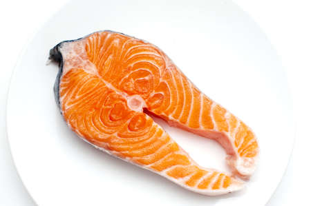 Fresh Salmon on a plate isolated on white backgroundの写真素材
