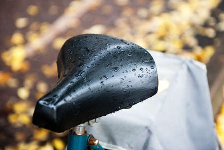 The seat of a bicycle with raindropsの写真素材