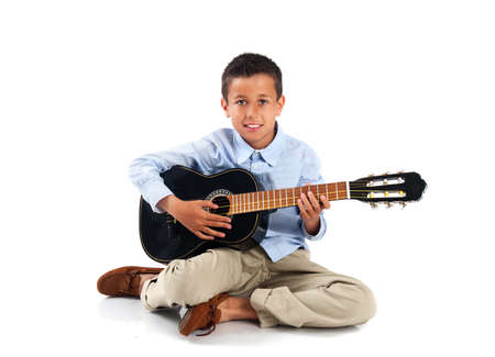 young boy with a guitar on a white background isolatedの写真素材