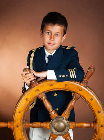 A boy with a beautiful sea wheelの写真素材