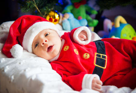Newborn baby boy dressed as Santa Clausの写真素材