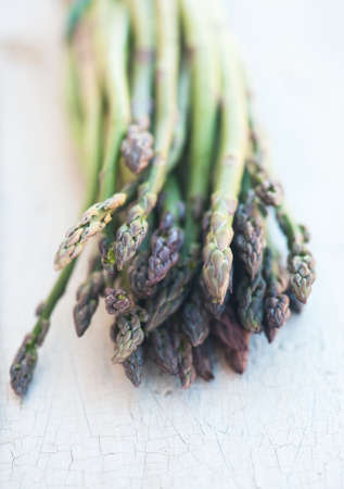 Fresh organic asparagus on a wooden cutting boardの写真素材