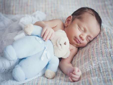 Little newborn baby boy 14 days, sleepsの写真素材