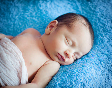 Little newborn baby boy 14 days, sleeps