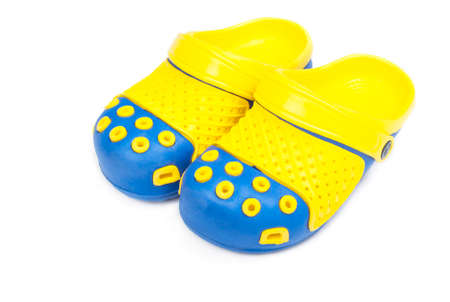 Children's bright rubber sandals isolated on white backgroundの写真素材