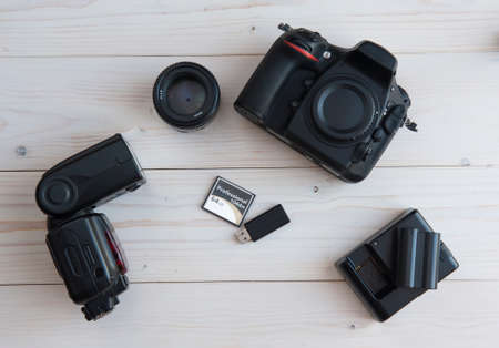 Photographic objects on a light wooden background
