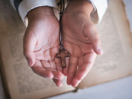 Cross in the childs hand.の写真素材