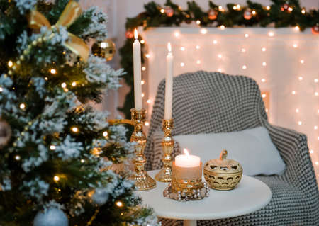 New Years candles and a Christmas tree in the lights.の写真素材