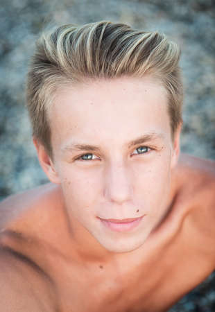 Handsome young guy in the parkの写真素材