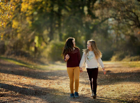 Two happy girls. Little girlfriends in park. Children Friendshipの写真素材