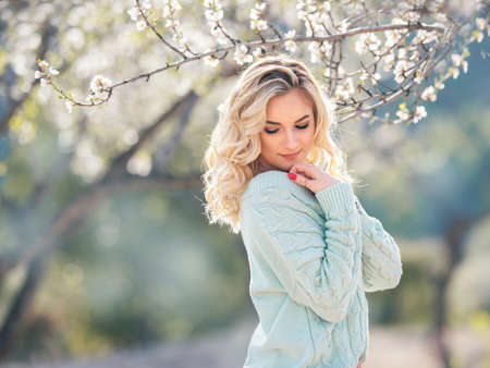beautiful red hair girl in the flower gardenの写真素材