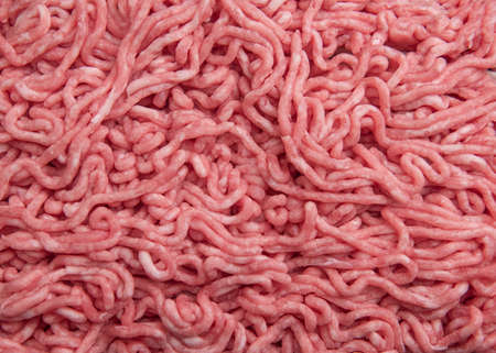 Beef minced meat as background, top view