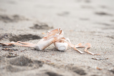 Pointe shoes for ballet. Pointe shoes lie on the sand. ballet shoesの写真素材