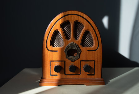 Retro radio with sunlight on a colored background.の写真素材