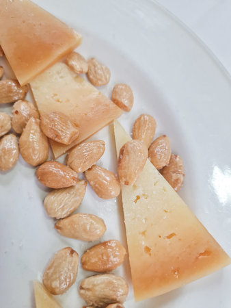 Gourmet snack of aged cheese and nuts, restaurant serving, healthy food concept, keto diet, closeup...