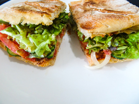A toasted bread sandwich with a flling of vegetablesの写真素材