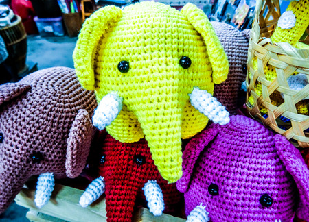 Colorful elephants made of cotton looing towards youの写真素材