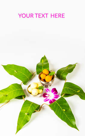 indian festival dussehra, showing golden leaf with traditional indian sweets pedha in silver bowl, Dussehra greeting cardの写真素材