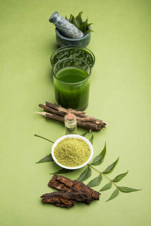 Indian couple using smartphone / mobile handset, standing isolated over white backgroundの写真素材