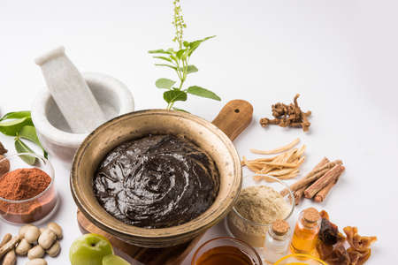 Indian Ayurvedic dietary supplement called Chyawanprash / chyavanaprasha is a cooked mixture of sugar, honey, ghee, Indian Gooseberry (amla), jam, sesame oil, berries, herbs and various spicesの写真素材