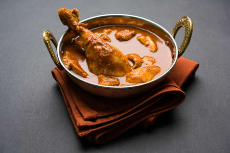 Indian spicy Chicken curry or masala chicken with prominent leg piece, popular recipe from India, selective focusの写真素材