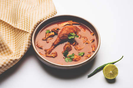 Indian spicy Chicken curry or masala chicken with prominent leg piece, popular recipe from India, selective focusの写真素材